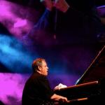 Kenny Werner with Jean Toots Thielemans projected in the background photo Hans Speekenbrink